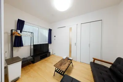 a living room with a couch and a table at Convertel Setagaya - Vacation STAY 45953v in Tokyo