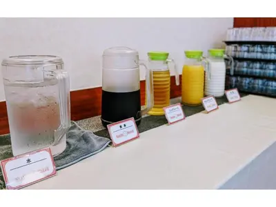 a table with several glass jars with liquid on it at Smile Hotel Tokyo Ayase Ekimae - Vacation STAY 62844v in Tokyo