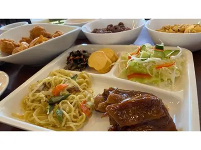 a plate of food with pasta and meat and other foods at Smile Hotel Tokyo Ayase Ekimae - Vacation STAY 62847v in Tokyo