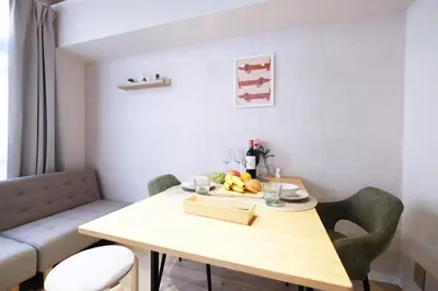 a dining room with a table with fruit on it at Belshaart Kamikitazawa - Vacation STAY 20402 in Tokyo