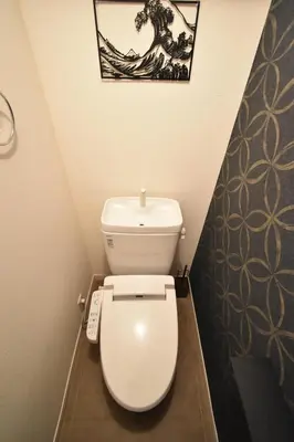 a white toilet in a bathroom with a picture on the wall at Kapalua East-Kapalua West - Vacation STAY 20388 in Tokyo