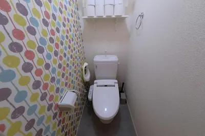 a bathroom with a toilet and a colorful wall at Kapalua East-Kapalua West - Vacation STAY 20389 in Tokyo