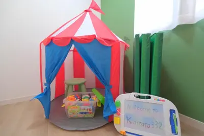 a red white and blue tent with a chair in it at Kapalua East-Kapalua West - Vacation STAY 20389 in Tokyo