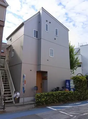 a large white building with a staircase next to a street at K,AND,M,OOIMACHI - Vacation STAY 60966v in Tokyo