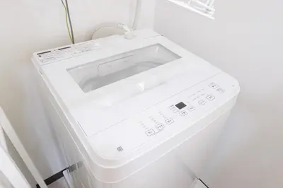 a white washer and dryer in a room at Kitakoiwakotate - Vacation STAY 20435 in Tokyo
