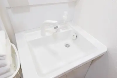 a bathroom with a white sink and a toilet at Kitakoiwakotate - Vacation STAY 20435 in Tokyo