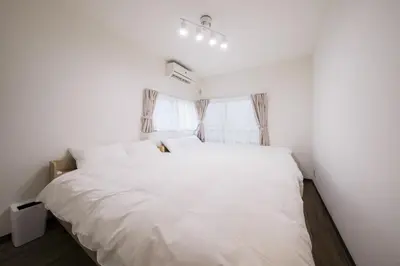 a white bed in a room with a window at Kitakoiwakotate - Vacation STAY 20435 in Tokyo