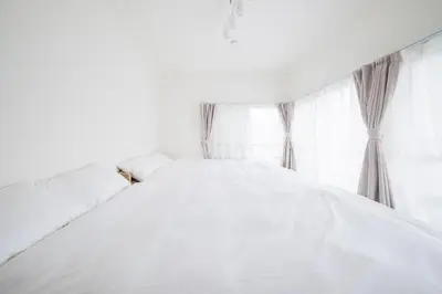 a white bed in a bedroom with a window at Kitakoiwakotate - Vacation STAY 20435 in Tokyo