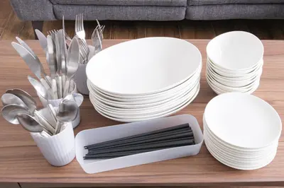 a group of white plates and utensils on a table at Kitakoiwakotate - Vacation STAY 20435 in Tokyo