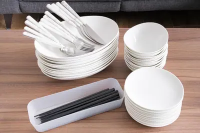 a pile of white plates and utensils on a table at Kitakoiwakotate - Vacation STAY 20435 in Tokyo