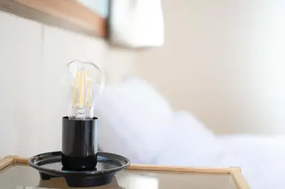 a black light bulb sitting on top of a table at ever Inn Asagaya in Tokyo