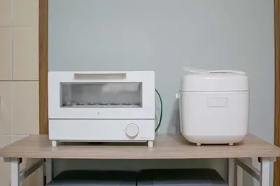 a microwave and a printer on a table at ever Inn Asagaya in Tokyo