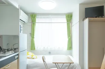 a small kitchen with a table and a window at Zenith Shinjuku Hinoki Building B by Tranova in Tokyo