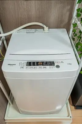 a white printer sitting on top of a shelf at 201 6-min walk from Higashi-Jūjō Station Cozy 1-Bedroom Apartment Direct Access to Akihabara & Ueno in Tokyo