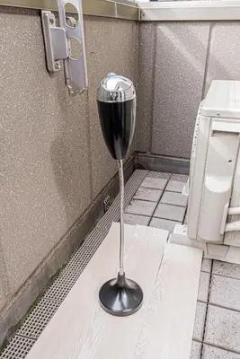 a wine glass sitting in the corner of a bathroom at 201 6-min walk from Higashi-Jūjō Station Cozy 1-Bedroom Apartment Direct Access to Akihabara & Ueno in Tokyo