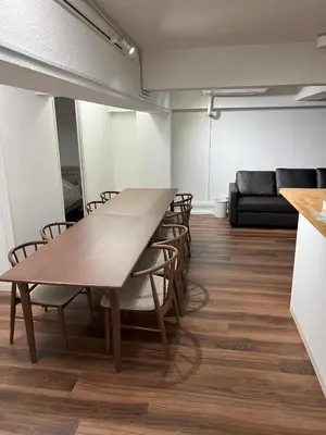 a conference room with a long wooden table and chairs at Mizuochi Building No, 1, 1F - Vacation STAY 67443v in Tokyo