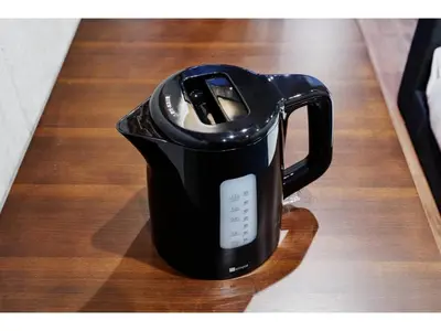 a black coffee pot sitting on a wooden table at LIFE TOWN OSHIAGE - Vacation STAY 20455 in Tokyo
