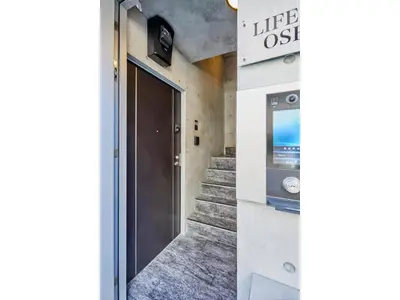 a hallway with a door and stairs in a building at LIFE TOWN OSHIAGE - Vacation STAY 20456 in Tokyo