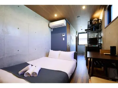 a small bedroom with a bed and a desk at LIFE TOWN OSHIAGE - Vacation STAY 20457 in Tokyo