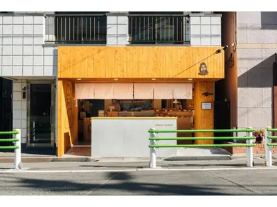 two green benches sitting in front of a building at LIFE TOWN OSHIAGE - Vacation STAY 20459 in Tokyo