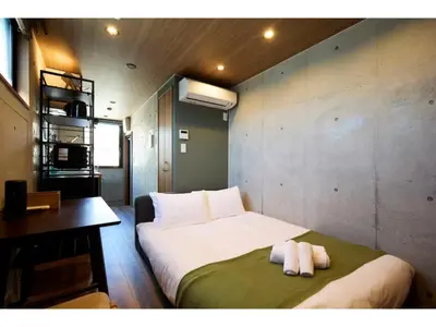 a bedroom with a bed with two towels on it at LIFE TOWN OSHIAGE - Vacation STAY 20460 in Tokyo
