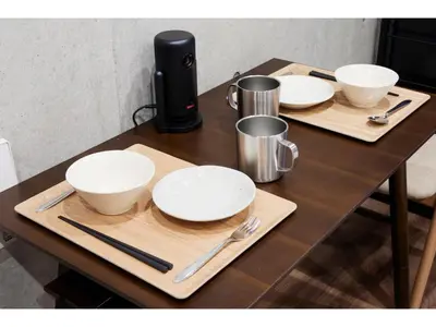 a wooden table with plates and utensils on it at LIFE TOWN OSHIAGE - Vacation STAY 20463 in Tokyo