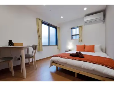 a bedroom with a bed and a desk and a table at LIFE TOWN SHINKOIWA - Vacation STAY 20473 in Tokyo