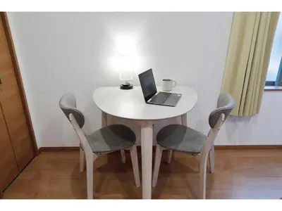 a white table with a laptop on it with two chairs at LIFE TOWN SHINKOIWA - Vacation STAY 20473 in Tokyo