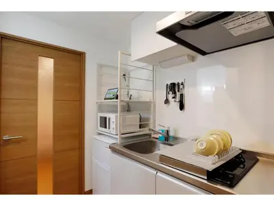 a small kitchen with a sink and a microwave at LIFE TOWN SHINKOIWA - Vacation STAY 20473 in Tokyo