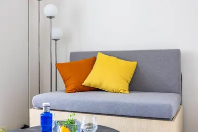 a couch with two pillows on top of a table at Daffitto\u62bc\u4e0aI in Tokyo
