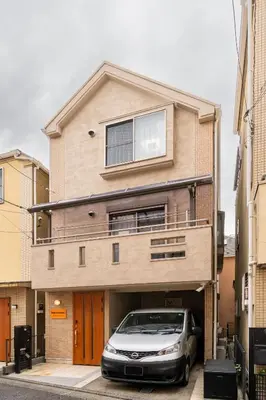 a car parked in front of a house at Familia Kamata 1 in Tokyo
