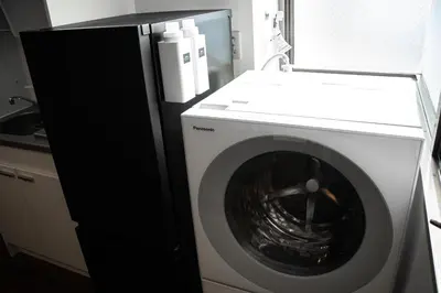 a white washer and dryer in a kitchen at studio aoi 202 in Tokyo