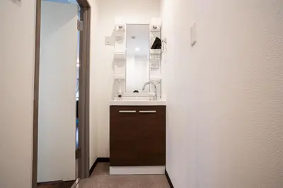 a small bathroom with a sink and a mirror at studio aoi 202 in Tokyo