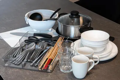 a table with a tray of utensils and cups at studio aoi 202 in Tokyo
