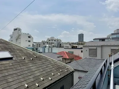 a view of a city with roofs and buildings at Oji kajiwara house in Tokyo