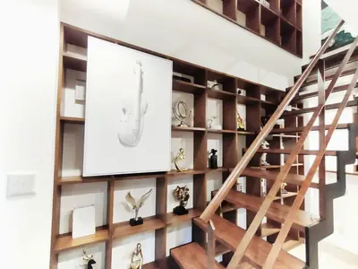 a room with a staircase with wooden shelves and a large painting at \u8fd1\u4e0a\u91ce \u5168\u65b0\u88c5\u4fee 2\u5ba41\u53851\u6d74\u5ba41\u536b\u751f\u95f4 \u8bbe\u65bd\u9f50\u5168 \u6700\u59275\u4eba Ueno 2 rooms 1dining room 1 bathrooms 1toilets Max 5P in Tokyo
