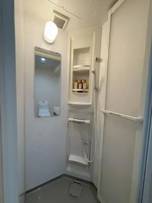 a bathroom with a shower with a toilet in it at \u79cb\u306e\u65c5\u9928 in Tokyo