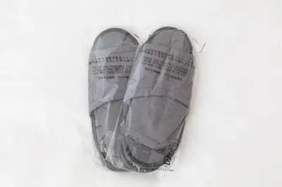 a pair of shoes in a plastic bag at Kotori Itabashi in Tokyo