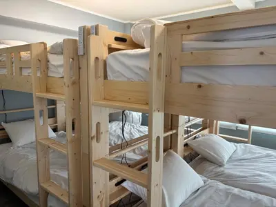 a group of bunk beds in a room at Art House Katsushika in Tokyo