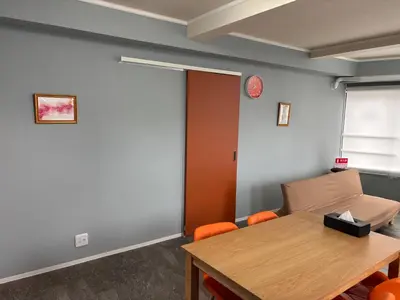 an office with a table and chairs and a door at Art House Katsushika in Tokyo