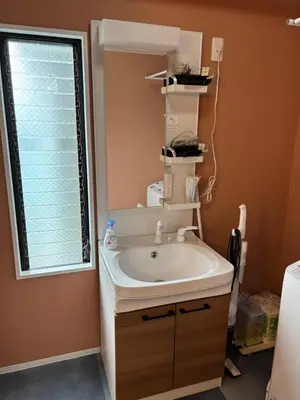 a bathroom with a sink and a window at Art House Katsushika in Tokyo