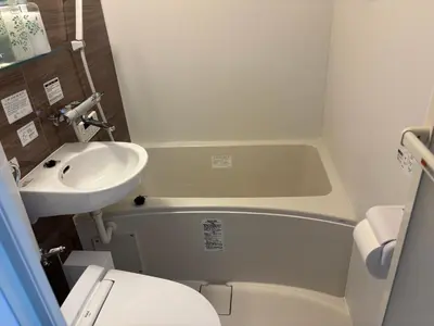 a small bathroom with a sink and a toilet at Art House Katsushika in Tokyo