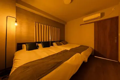 a bedroom with a large bed in a room at Terrace Tokyo Otsuka in Tokyo