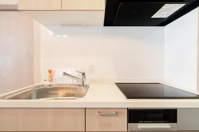 a kitchen with a sink and a microwave at Terrace Tokyo Otsuka in Tokyo