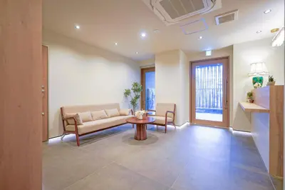 a living room with a couch and a table at Nakano World Hotel in Tokyo