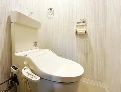 a bathroom with a white toilet in a stall at shinjuku kasa 1302 in Tokyo