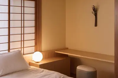 a room with a bed and a desk with a lamp at Home suite Home Hatsudai - 1 stop from Shinjuku! Your urban hideaway 3BR 6beds in Tokyo