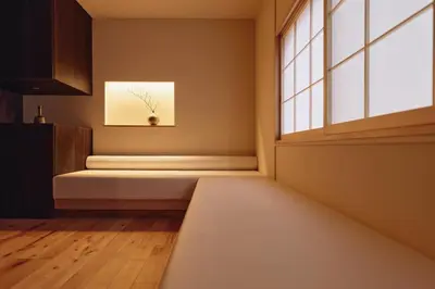 a room with a bench in front of a window at Home suite Home Hatsudai - 1 stop from Shinjuku! Your urban hideaway 3BR 6beds in Tokyo