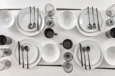 a bunch of plates and utensils on a table at Tokyo Modern Sakura House Gakugei 7min Shibuya by TRAIN Sakura River 10 min in Tokyo
