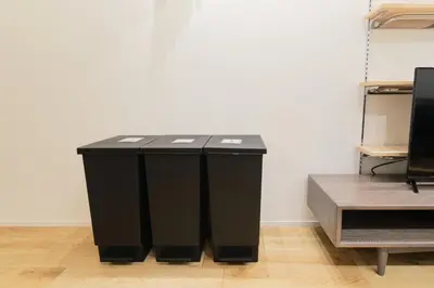 a black table in a room next to a wall at monthly Grand Maison Natsumezaka in Tokyo